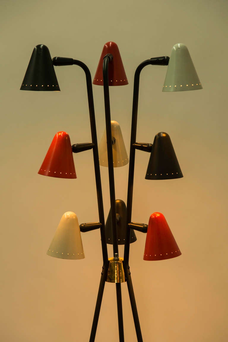 Nine shade floor lamp.  Original colors to shade.  Each shade pivots up/down