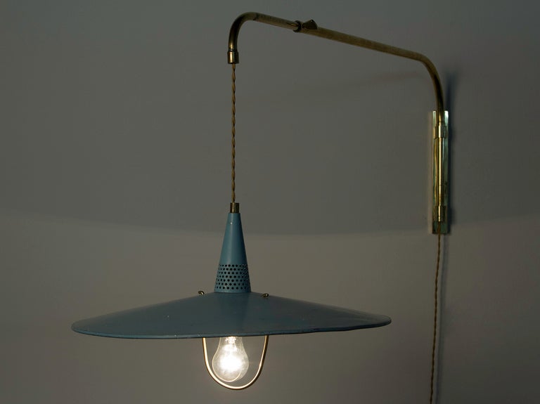 Wall-mounted lamp with weighted counter balance and extendable arm. Left/right, up/down directionable.