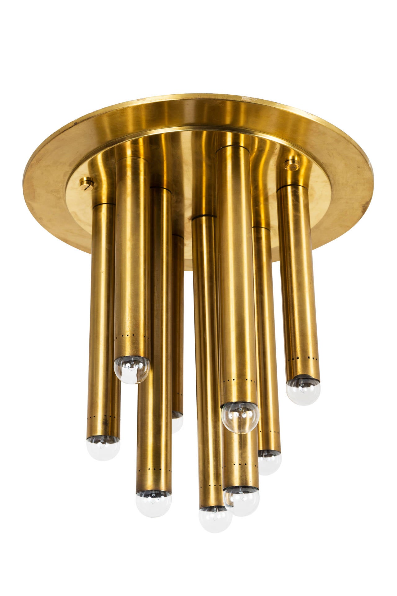 Single brass ceiling lights with nine brass cylinders per light. Small perforated detail at the base of each cylinder. E27 15w maximum bulb per socket. Retains original manufacturers label.