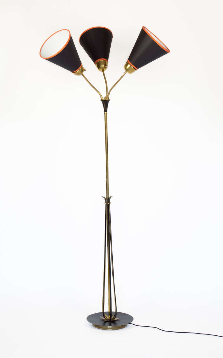 Articulated mid-century floor lamp.
Very attractive and elegant shades.  Manufactured by Lunel.
Black Enamel finish with brass accents including a lotus leaf detail.  Each light has its own switch.  Fixture uses three E14 (European) candelabra