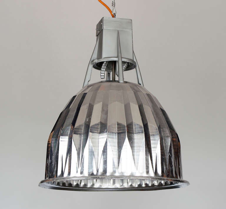 A creative way to light up a workspace in a kitchen or office.  They are more decorative than most industrial pendants. The crinkled shape of the bell housing  diffuse the light beautifully. The frame has many interesting little details, which catch