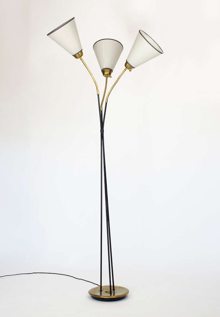 Articulated mid-century floor lamp.
Very attractive and elegant shades.  Manufactured by Lunel.
Black Enamel finish with brass accents.  Each light has its own switch.  Fixture uses three E14 (European) candelabra based bulbs,  adapters for