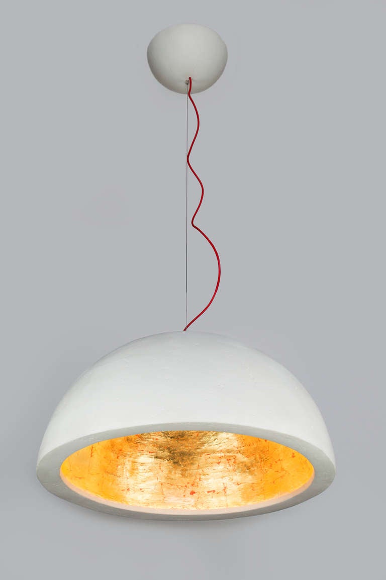 The dome creates a wonderful down light. Its plaster finish gives it texture and character. The gold leaf interior provides for a warm glow, the dimmer allow you to adjust the brightness to create the perfect atmosphere. It is lightweight in