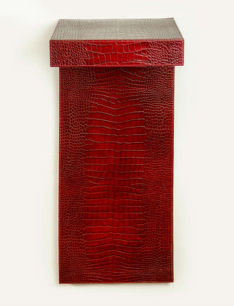 Two L shaped shelves covered with embossed crocodile motif leather.  Beautiful rich red coloration with detailed stitching.  Created by D C and Company- Paris.
Hangs easily on the wall with two screws.  Sold as a pair
