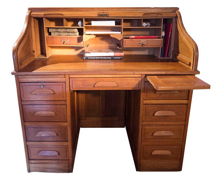Beautiful oak desk with a lot of compartments.
The roll top works perfectly which locks.