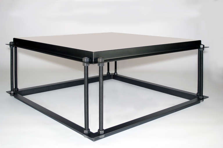 Steel coffee table with bronze mirrored top.  Gun metal finish  (Table in 1STDIBS@NYDC Showroom, NYC.)