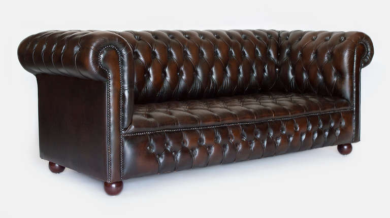 Vintage leather tufted in excellent condition.  Seats three.  The tufting is in perfect condition.  Beautiful warm patina.