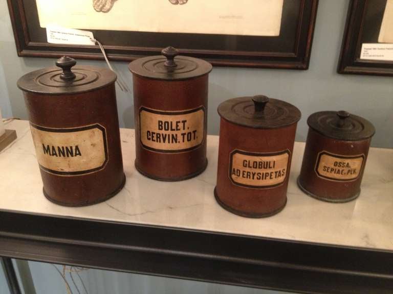 Four wooden containers with original Labels from a French pharmacy.  Turned wooden lids.  Excellent condition.  Items are in the 1STDIBS@NYDC showroom.