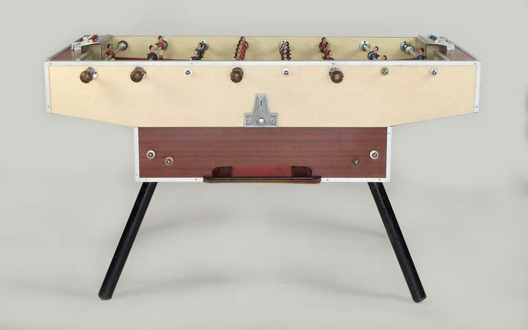 From a French bistro, this game is in great condition and plays well.  Manufactured by Suplie in Cognac, France,  this bistro model has a formica finish and steel legs.  The playing field is flat and the players are all in great shape.  The money