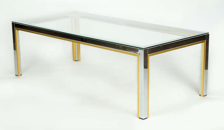 Renato Zevi coffee table.
Chrome and brass frame with a glass top
We also have two companion pieces of this design.