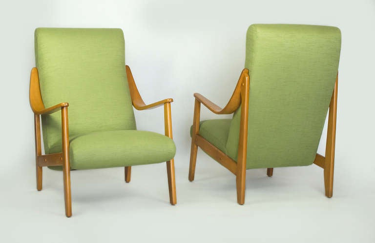 Beautiful pair of pair of mid-century armchair.
Totally restored with new upholstery . The wood has been refinished in his original natural color .