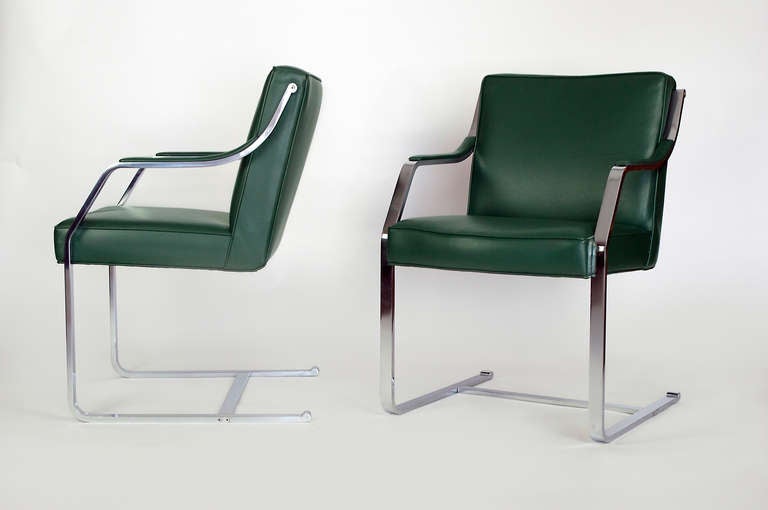 Pair of beautiful armchair with a heavy duty high quality chromed frame.
The unique arm design with the graceful bends creates a stylish arm chair of the traditional cantilever chairs.