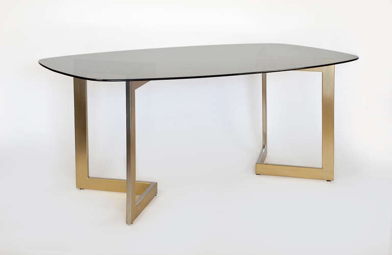 Brass plated base with a smoked glass top.
This table was designed by Francoise See in 1960 for Ramsay.