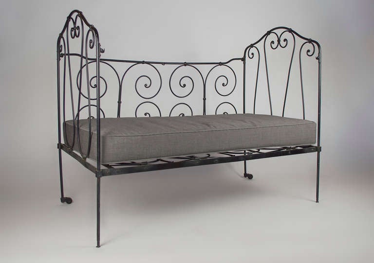 France
1940
This small day bed is from a vintage crib. The fourth panel of the crib is still intact and folded under the cushion. The frame of the crib has been stripped and powder coated to protect it from the elements, the cushion is made for