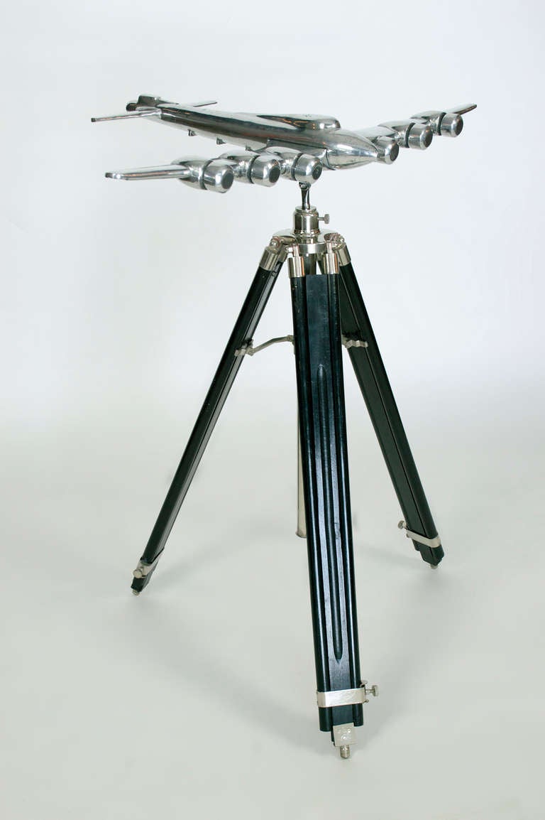 Unique six engine Airplane mounted on an ebony and aluminum base.<br />
Tripod base will adjust to 72