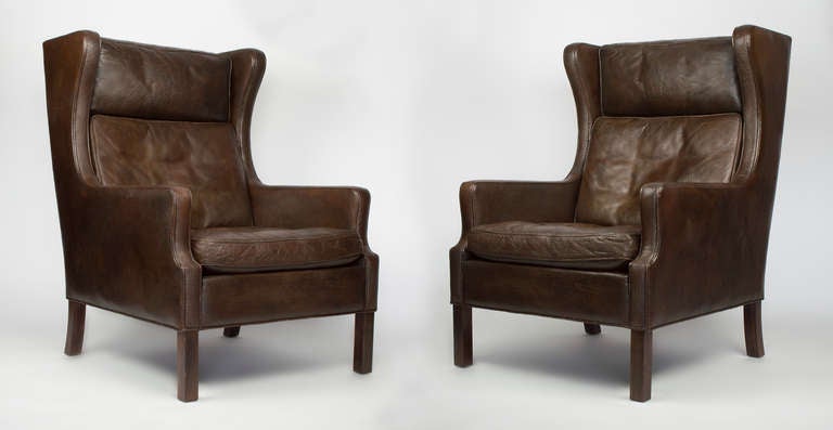 We are selling this hard to find pair of wingback chairs by Borge Morgensen.  Both of the chairs are in immaculate condition.  The Leather is in perfect condition.  Though there are many single chairs available by this designer, we are lucky to have