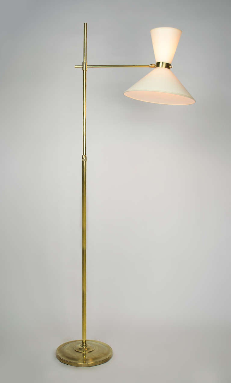 ￼This elegant floor lamp made of brass is completely adjustable. In addition, the head pivots. In its lower position, ( 50