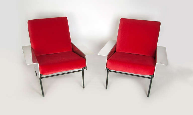 A pair of G10 Lounge chairs, with polished aluminum arms. The Aluminum model is a rare find.  Designed by Guariche and manufactured by Airborne in the mid 1950's  These chairs have been reupholstered keeping the original system upholstery.  Steel