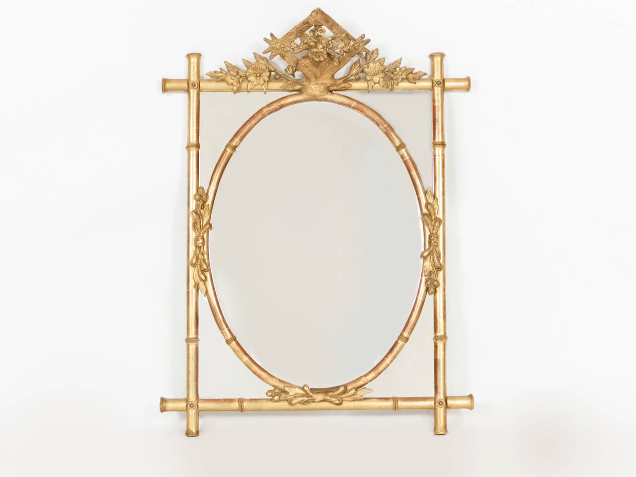 Unusual 1900 century mirror with original mercury mirror and frame.  The mirror has a bamboo motif and an exquisite crown.  Mirror is in our NYC showroom.
