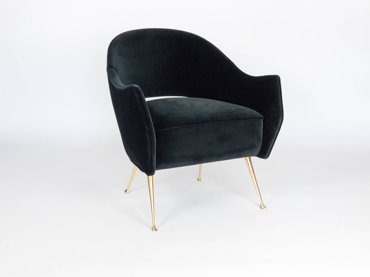 Two elegant chairs with cast brass legs and a distinctive curved back.
The chairs are very comfortable, perfect in size and are ideal as small
scale side chairs. The beauty of the tapered brass legs with their graceful
feet are sure to add that