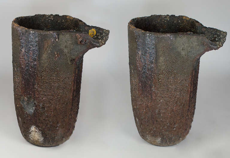 This matching pair of lava stone crucibles were used in a bronze foundry.  The pair are in good condition and create a unique planter or fountain.