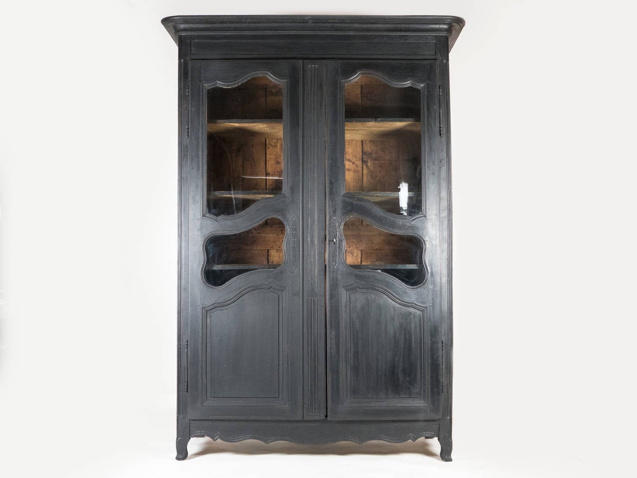 Classic Napoleon III Armoire with 4  glass windows on the door.
Can be used as a bookshelf , wardrobe or curio cabinet.

Beautiful black patina. Four shelves, one shelf with 2 drawers.