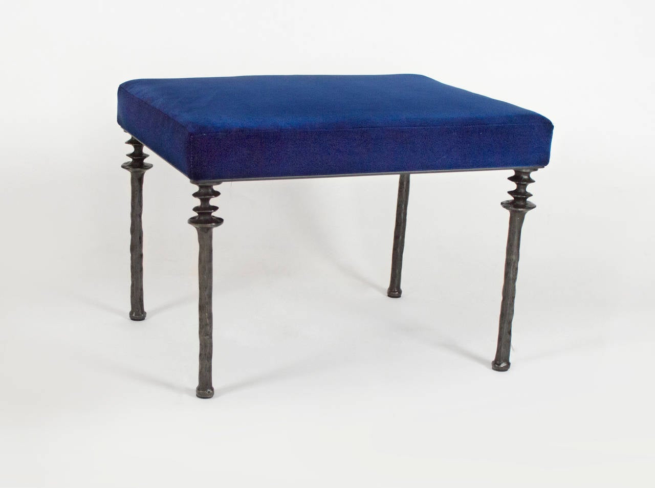 Two unique stools with cast bronze legs and royal blue velvet cushion.  These stools are located in our space in the 1STDIBS@NYDC showroom in NYC.