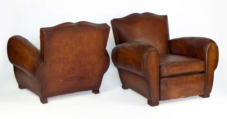 Beautiful original 1930's club chairs. Original leather and patina. These armchairs has been reinforced.