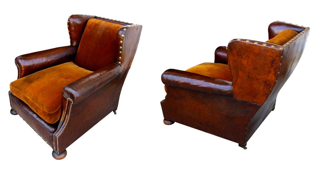 Oversized club chair with a great patina.  structurally solid with all nail heads intact.  beautiful lines and original brass casters.  comfortable and inviting.