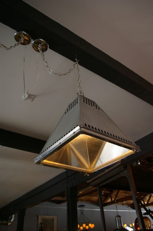 Unusual Pyramid Industrial Light fixtures.  Tin and Aluminum .  Pyramid Shape give a great lighting effect inside of fixture