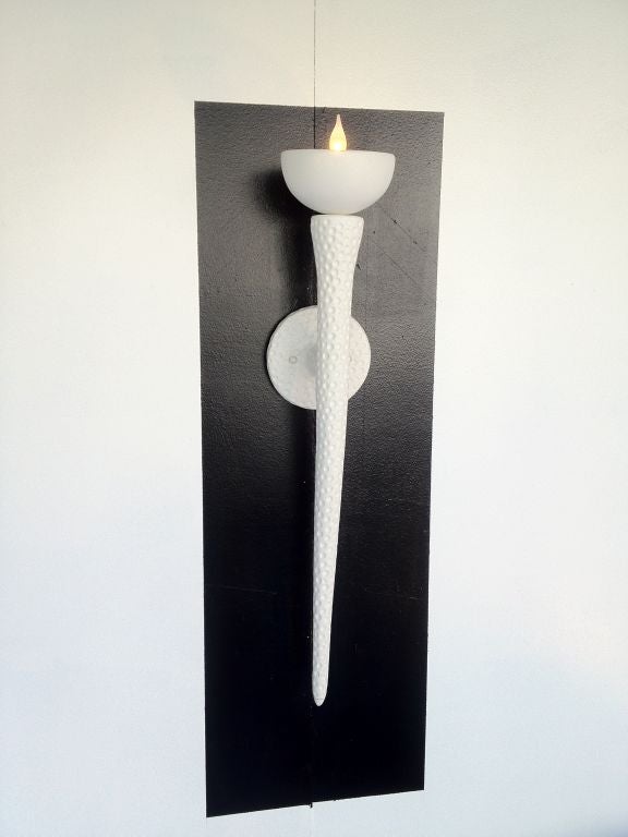 Pair of Plaster Wall Sconces with Dimpled finish.  Candelabra base socket.  Max 60 Watt.  Fits standard J box.