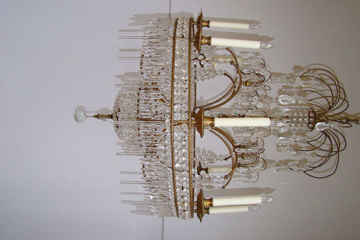 Highly stylized Swedish Palladian chandelier with faceted and teardrop crystals.
