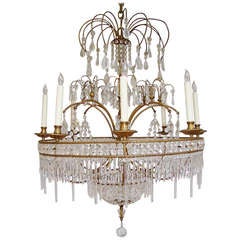 Highly stylized Swedish Palladian chandelier with faceted and teardrop crystals.