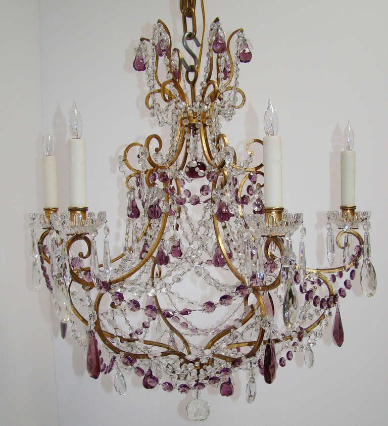 Italian gilt, iron and tole chandelier with clear and amethyst faceted crystals