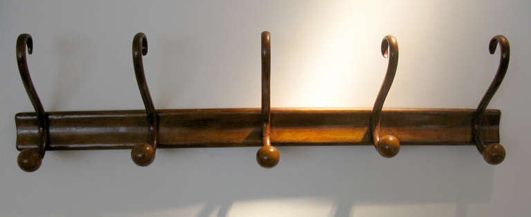 Thonet style bentwood coat rack with five coat & hat hooks.  The wood has a beautiful honey patina.