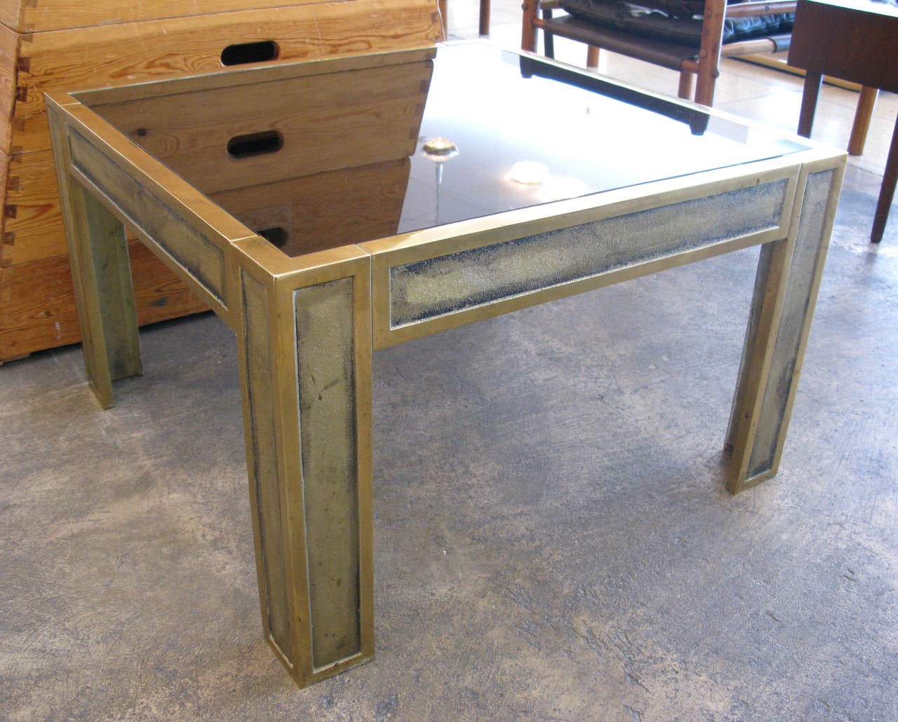 Pair of heavy brass side tables. Solid polished and textured brass frames with loose fitted smoky glass table tops.

* ON SALE - 65% OFF.  Originally $3800.  LIMITED TIME ONLY.  No further discounts apply.
 