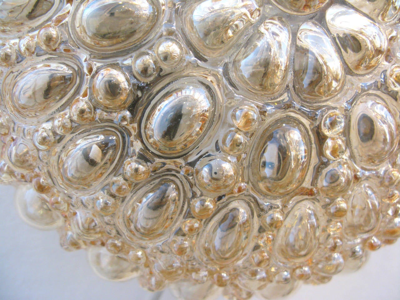 Pair of Round Limburg Amber Glass Sconces In Excellent Condition In Los Angeles, CA