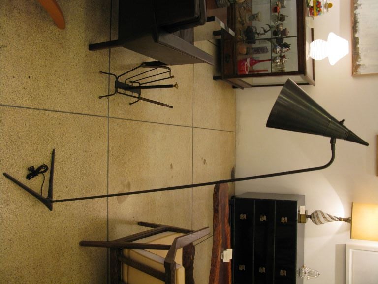 Handsome matte blackened gunmetal floor lamp with blackened brass & teak detailing. Shade can be adjusted forward and back.

*** ON SALE.  60% off list price until OCTOBER 3, 2014.  The price shown already reflects the 60% discount ***