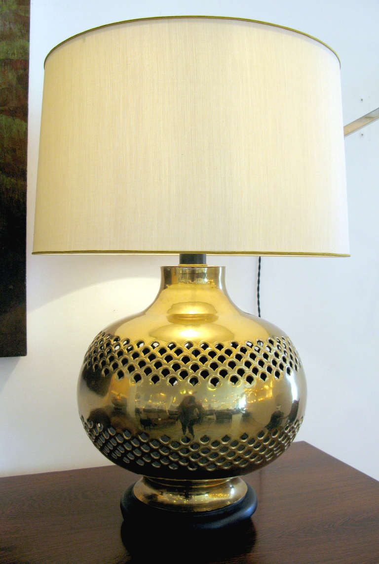 Beautiful pair of pierced brass table lamps.  New silk shades with gold trim.  Shades measure 16