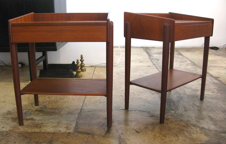 Pair of Borge Mogensen bedside tables in teak with angled sides.  Single drawer in each.  The actual table surfaces measure 19.75