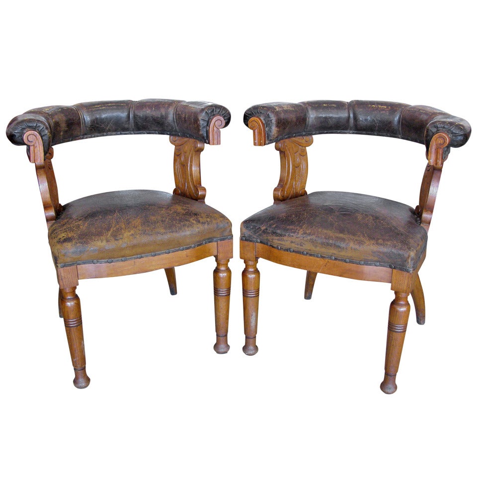 Pair of Aged Leather & Oak Armchairs