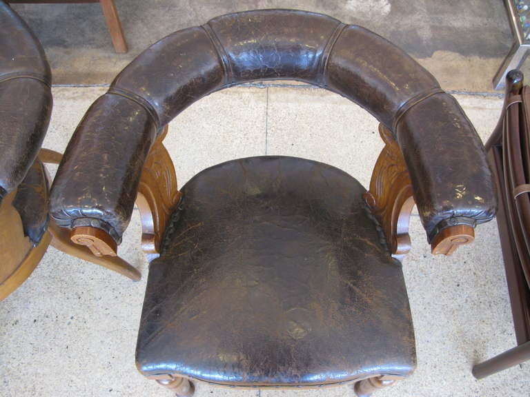 Pair of Aged Leather & Oak Armchairs In Distressed Condition In Los Angeles, CA