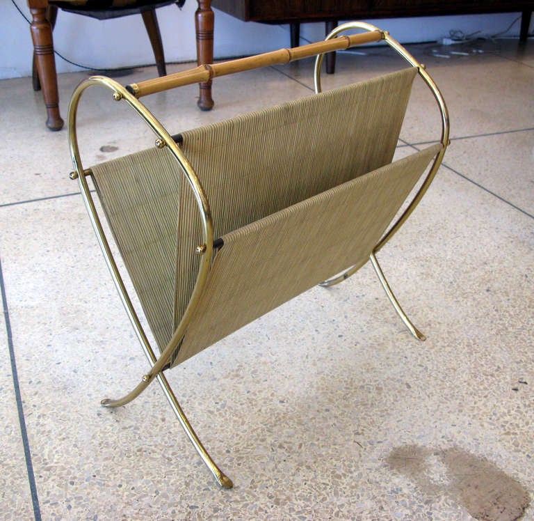 Elegant magazine rack with aged brass frame and bamboo detailing.