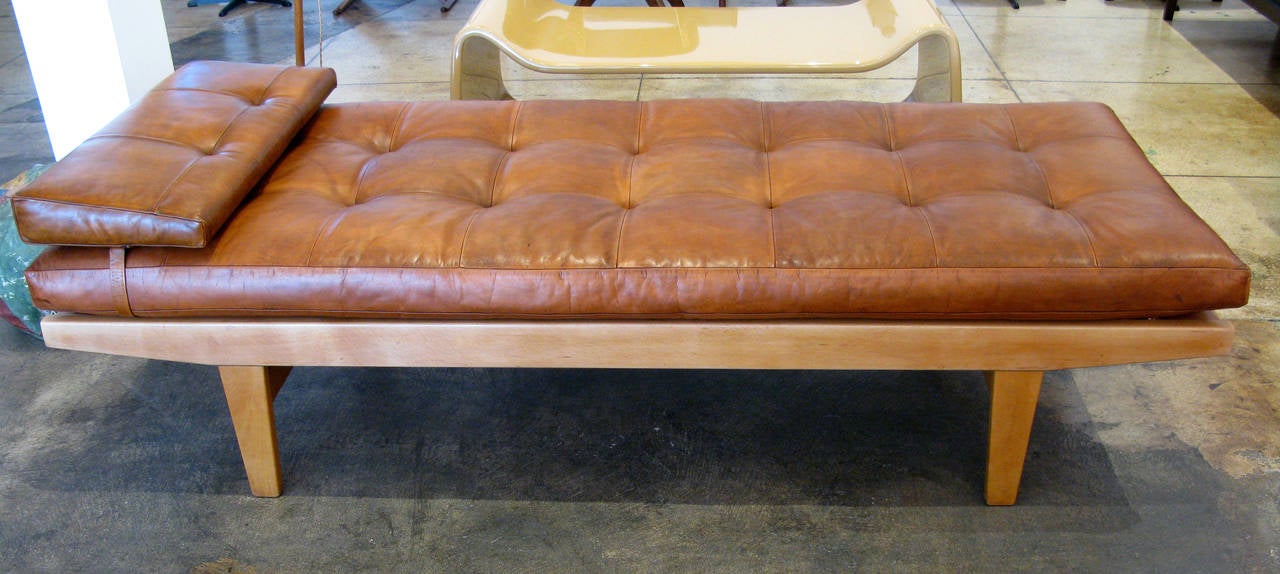 Leather and teak daybed by Poul Volther. Beautifully aged tufted cognac leather cushion with matching leather wedge pillow.