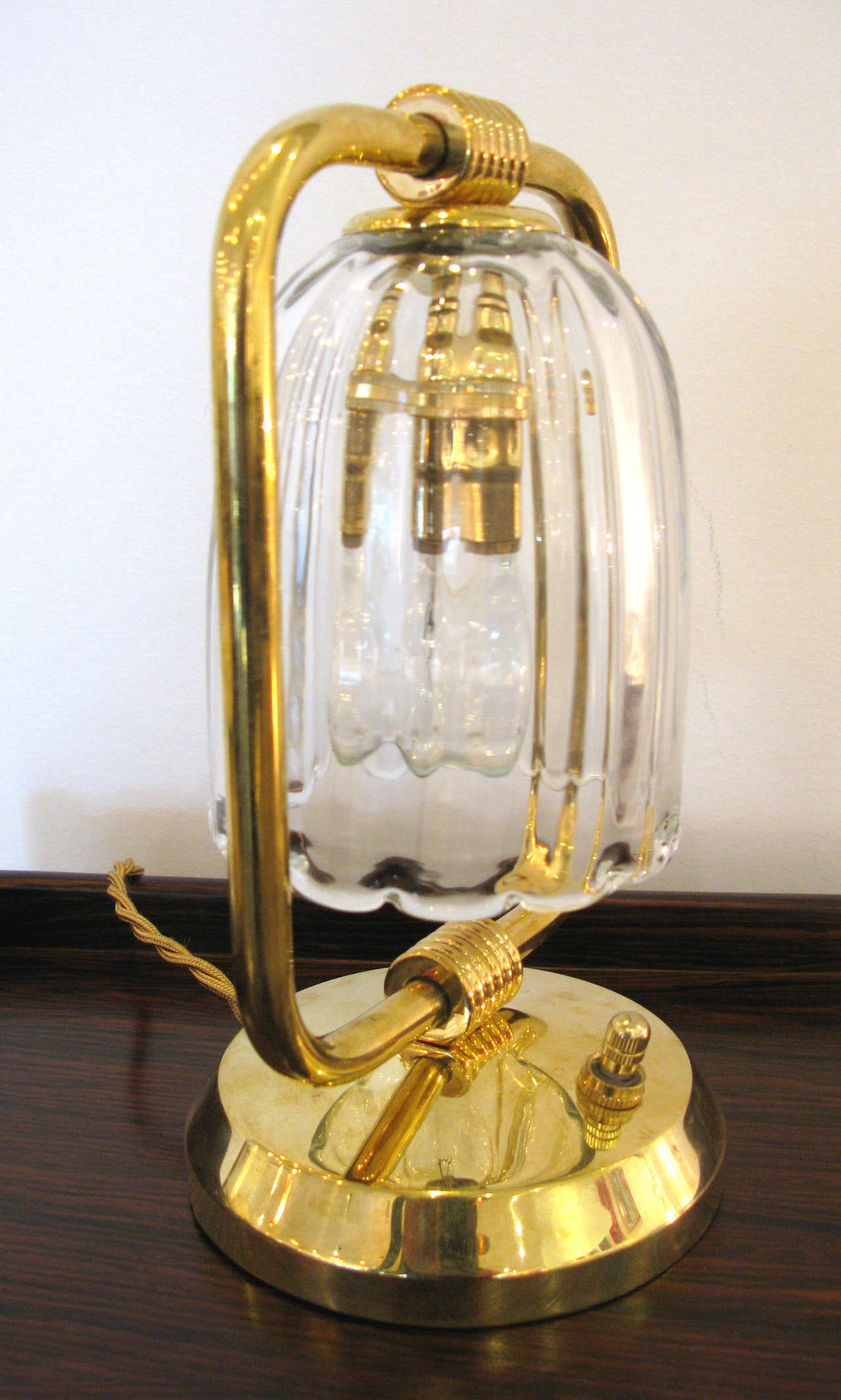 Pair of petite brass and glass desk lamps from Italy. Brass turn switch with gold twist cord.

* ON SALE - 70% OFF.  Originally $2800.  LIMITED TIME ONLY.  No further discounts apply.
 