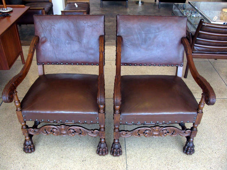 French Pair of Aged Leather & Wood Armchairs