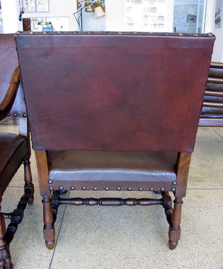 20th Century Pair of Aged Leather & Wood Armchairs