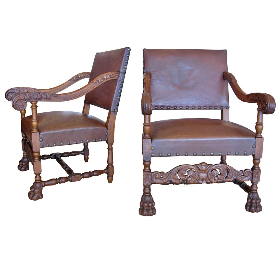 Pair of Aged Leather & Wood Armchairs