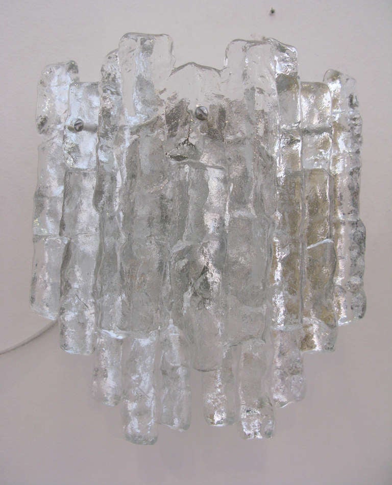 Pair of large, clear icy glass sconces by J.T. Kalmar.  Polished nickel hardware.