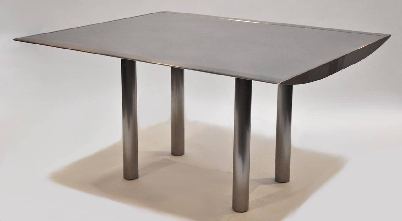 Stainless Steel Table with Four Leather and Steel Chairs For Sale at